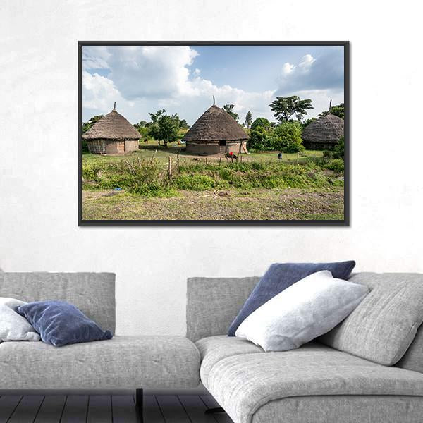 Omo Valley Straw Huts Canvas Wall Art in brown, green and blue, framed canvas, product view on a white background