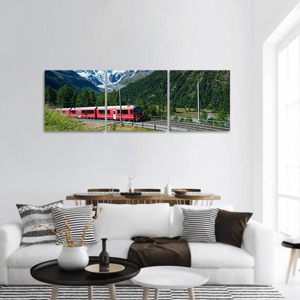 Bernina Express in Swiss Mountains Panoramic Canvas Wall Art in red, green and blue, hung on a wall