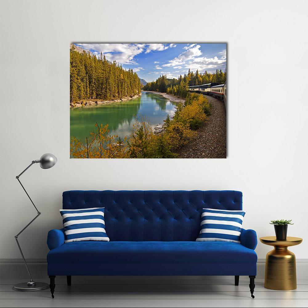 Train Along Turquoise Mountain Lake Canvas Wall Art in brown, green and blue, single panel hung on a wall