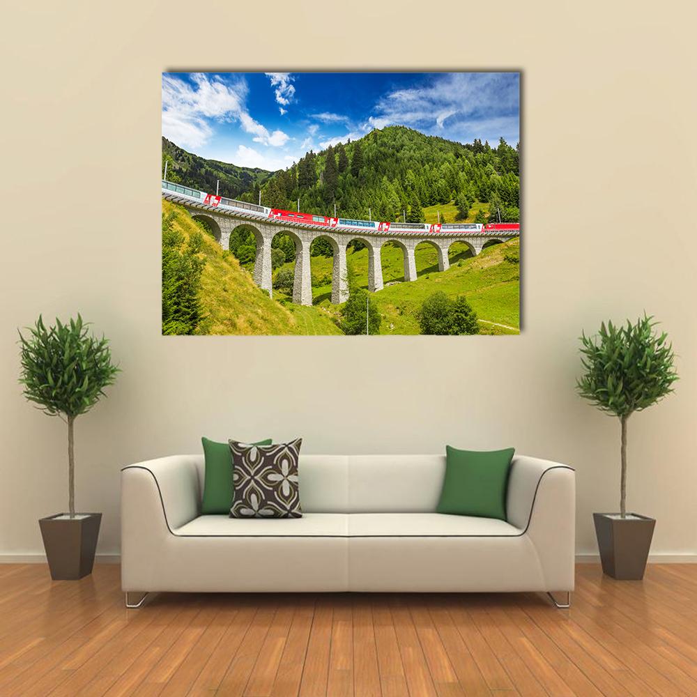 Red Train on Landwasser Viaduct Canvas Wall Art in white, green and blue, single panel hung on a wall