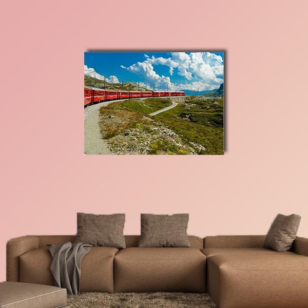 Red Passenger Train in Swiss Mountains Canvas Wall Art in red, green and blue, single panel hung on a wall