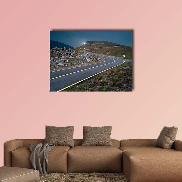 Transalpina Road at Dusk Canvas Wall Art in gray, brown and blue, single panel hung on a wall
