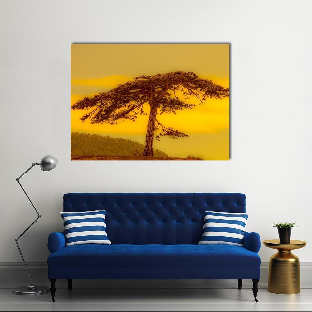 Lonely Tree on Hill Canvas Wall Art in brown, gold and yellow, single panel hung on a wall