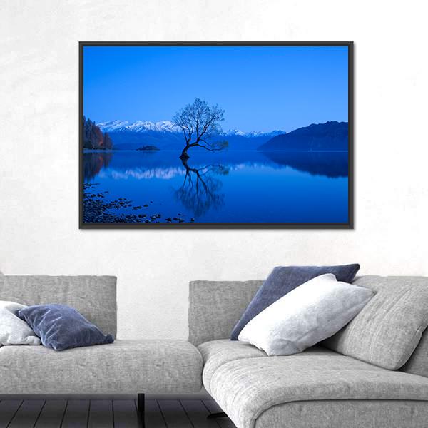 Moonlit Tree Over Lake with Snow-capped Peaks Canvas Wall Art in white, blue and navy, framed canvas, product view on a white background