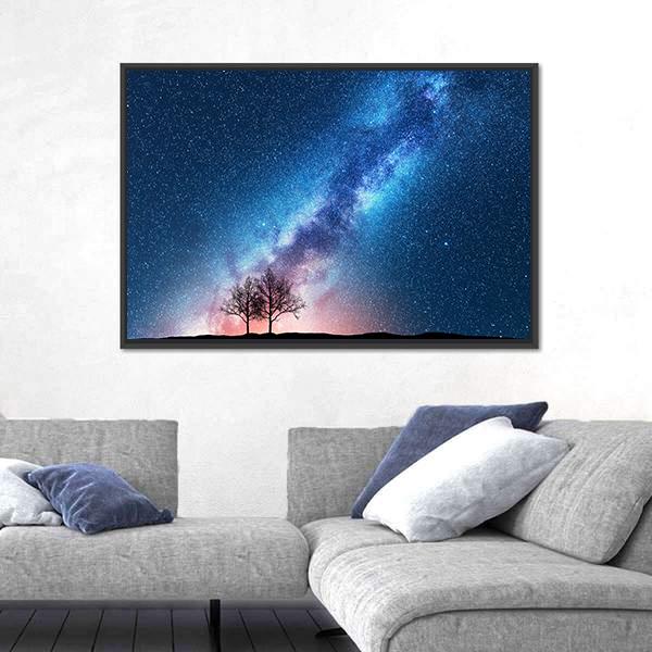 Milky Way Over Silhouetted Trees Canvas Wall Art in black, blue and purple, framed canvas, product view on a white background