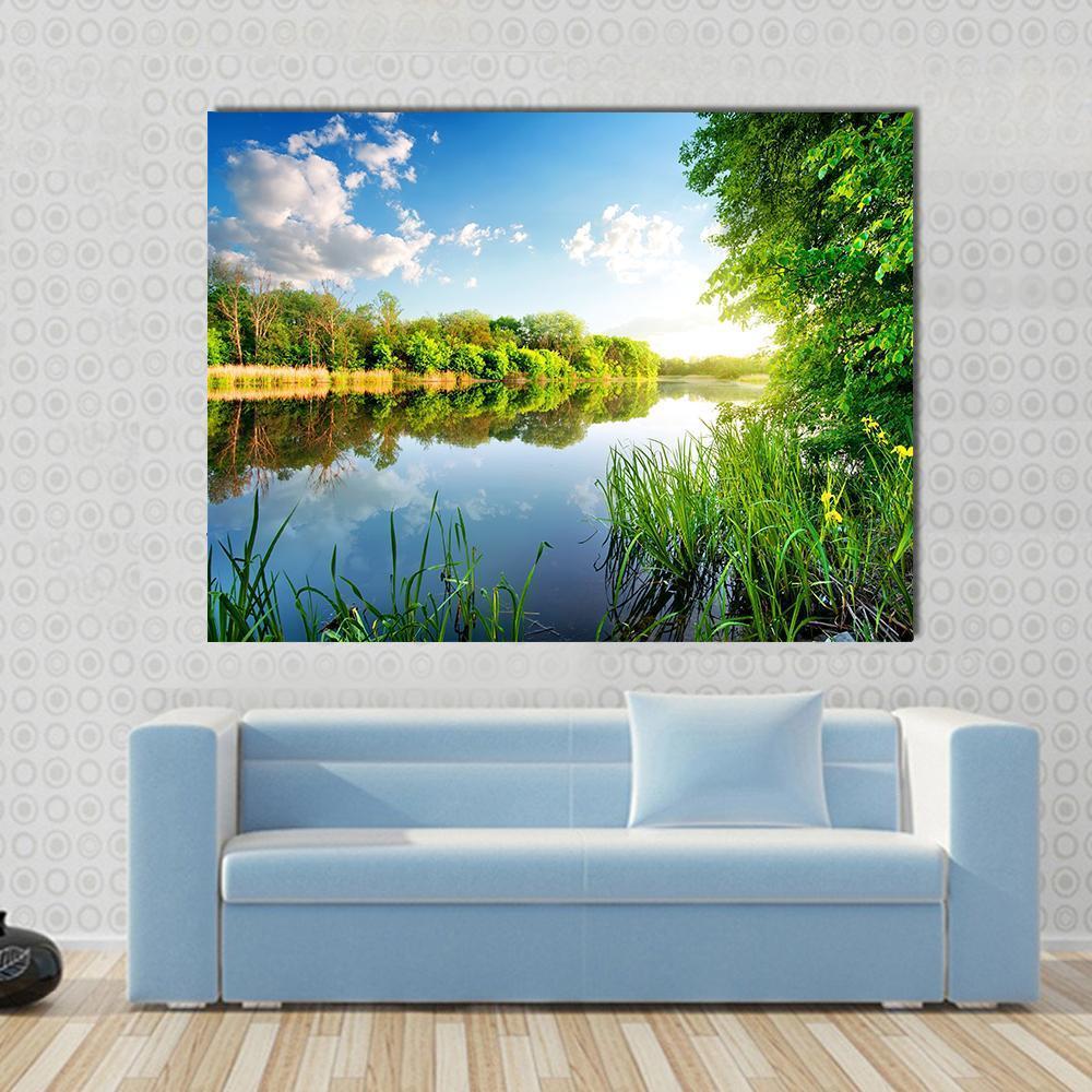 Trees by Calm River in the Morning Canvas Wall Art in white, green and blue, single panel hung on a wall