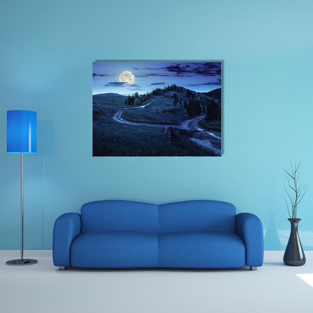 Moonlit Mountain Forest Path Canvas Wall Art in black, blue and navy, single panel hung on a wall