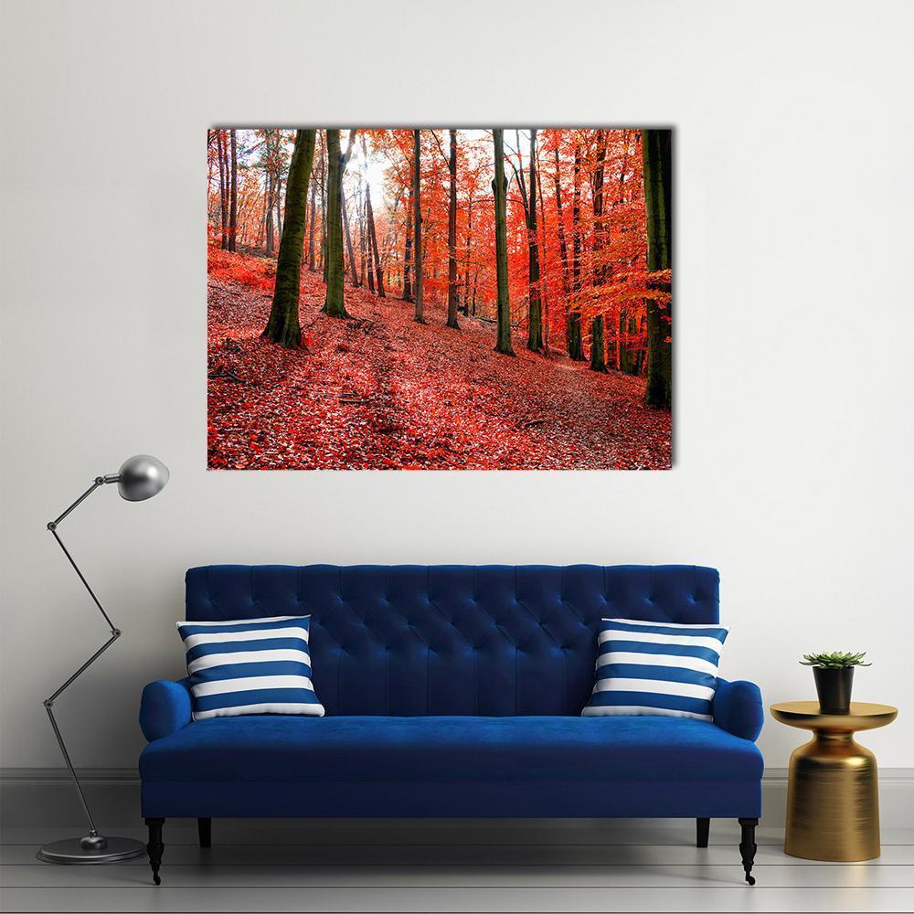 Red Autumn Leaves in Forest Canvas Wall Art in brown and red, single panel hung on a wall