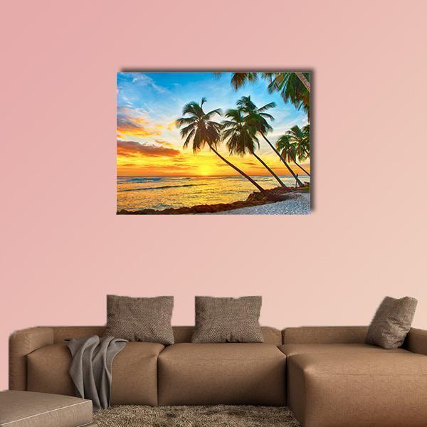 Leaning Palms at Tropical Sunset Canvas Wall Art in orange, yellow and blue, single panel hung on a wall