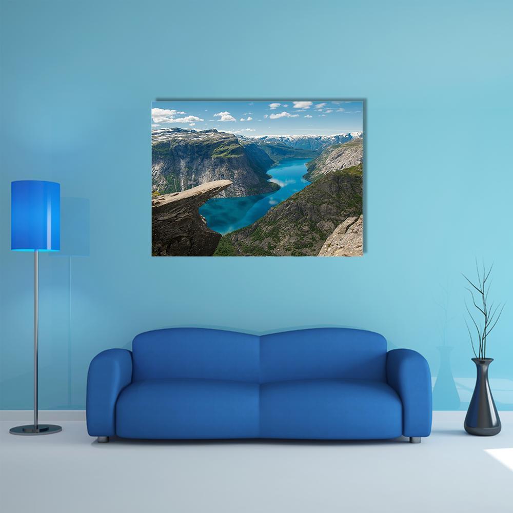 Trolltunga Rock Formation Canvas Wall Art in gray, green and blue, single panel hung on a wall