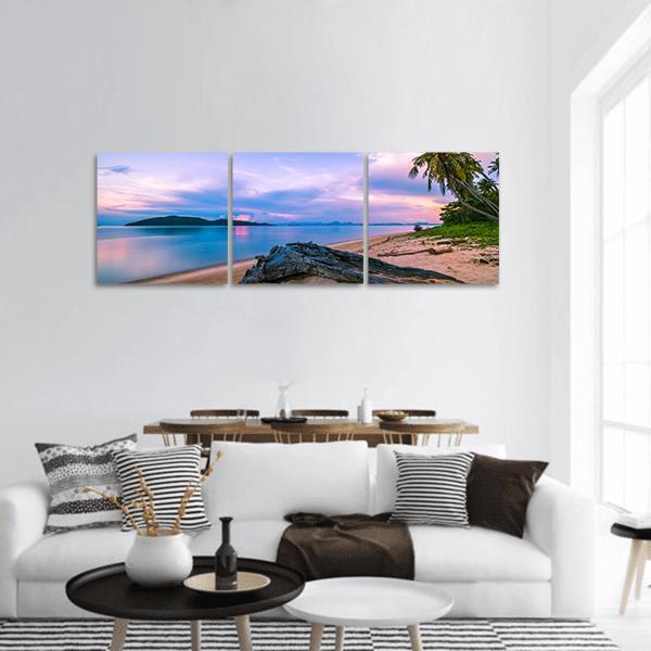 Tropical Beach at Twilight Panoramic Canvas Wall Art in blue, purple and pink, hung on a wall