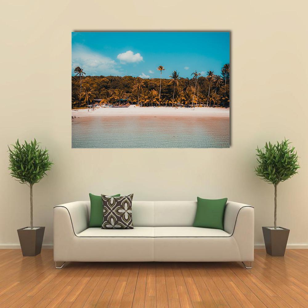 Tropical Beach with Palm Trees Canvas Wall Art in beige, brown and blue, single panel hung on a wall