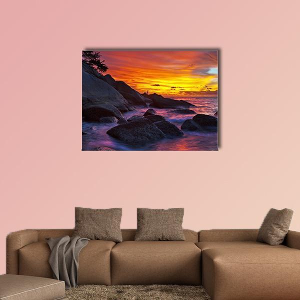 Tropical Beach at Sunset Canvas Wall Art in orange, yellow and purple, single panel hung on a wall