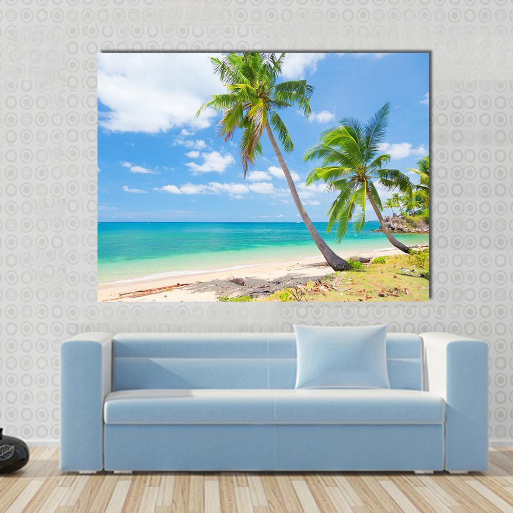 Tropical Beach with Coconut Palm Canvas Wall Art in beige, green and blue, single panel hung on a wall