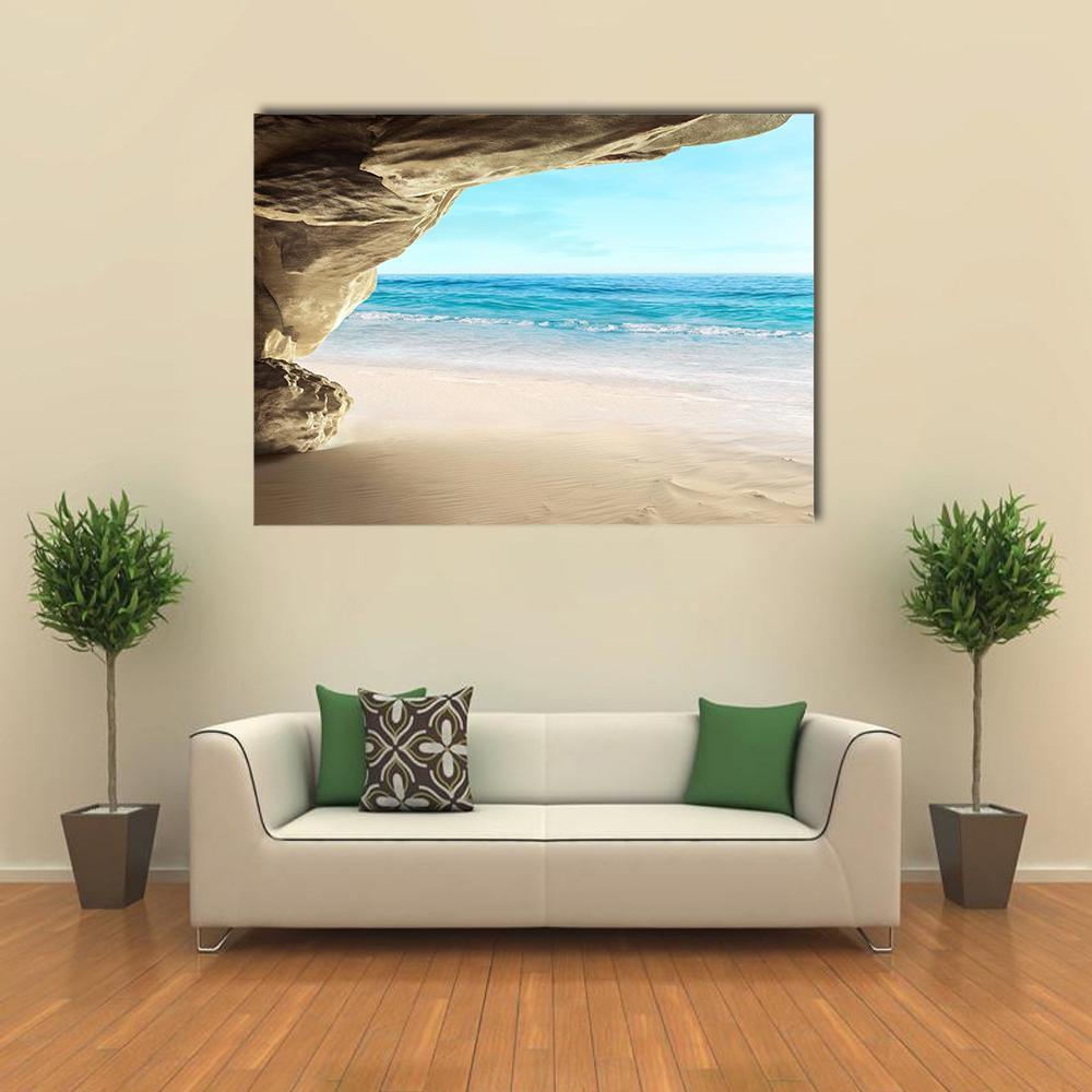 Tropical Cave Escape Canvas Wall Art in gray, beige and blue, single panel hung on a wall