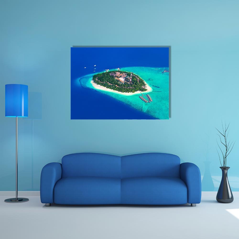 Maldives Tropical Island Aerial View Canvas Wall Art in green and blue, single panel hung on a wall