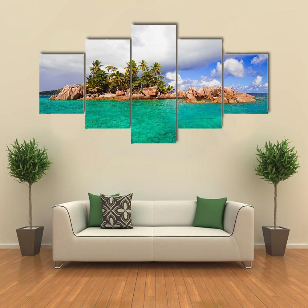 Tropical Island in Seychelles Canvas Wall Art in white, green and blue, 5 panel Star layout hung on a wall