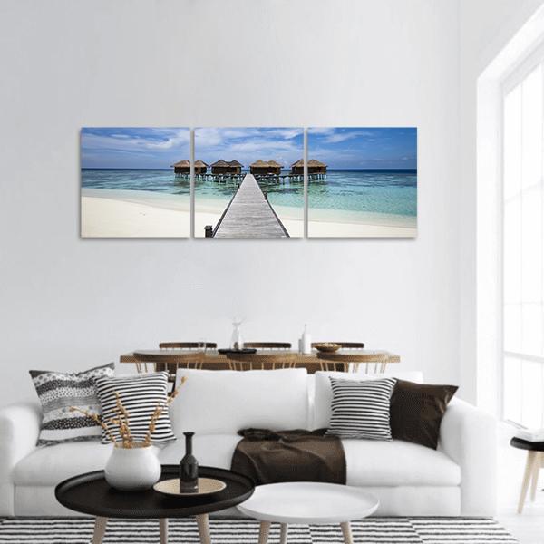 Tropical Island with White Sand Beach Panoramic Canvas Wall Art in white, beige and blue, hung on a wall