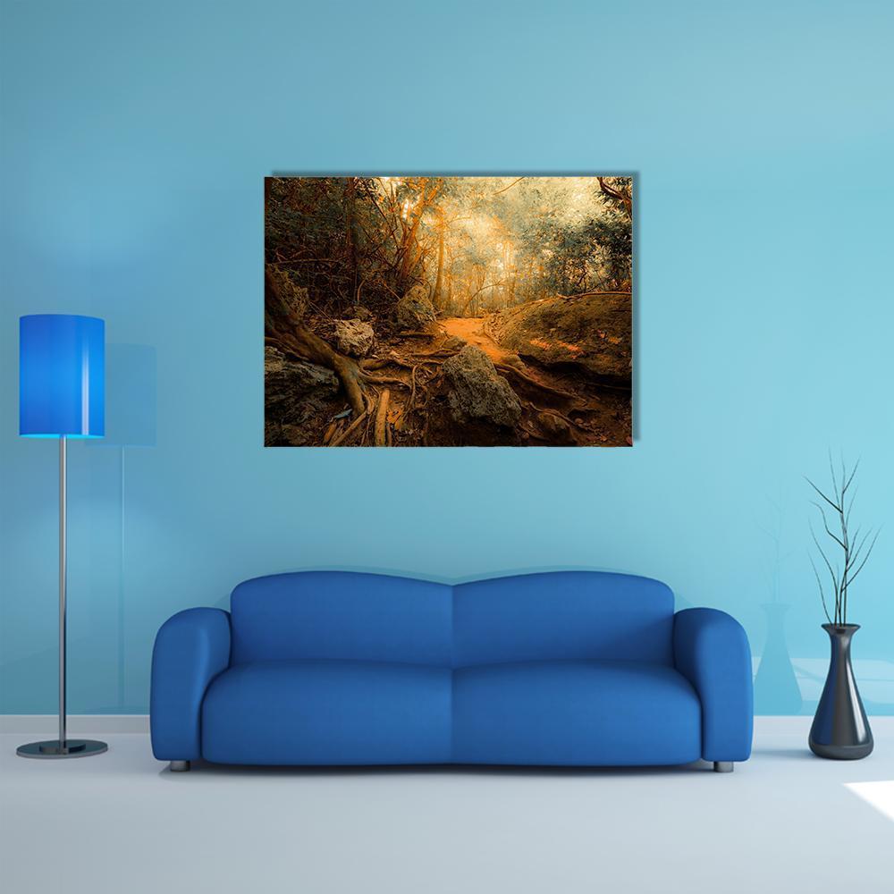 Tropical Forest Path with Gnarled Roots Canvas Wall Art in brown, orange and green, single panel hung on a wall
