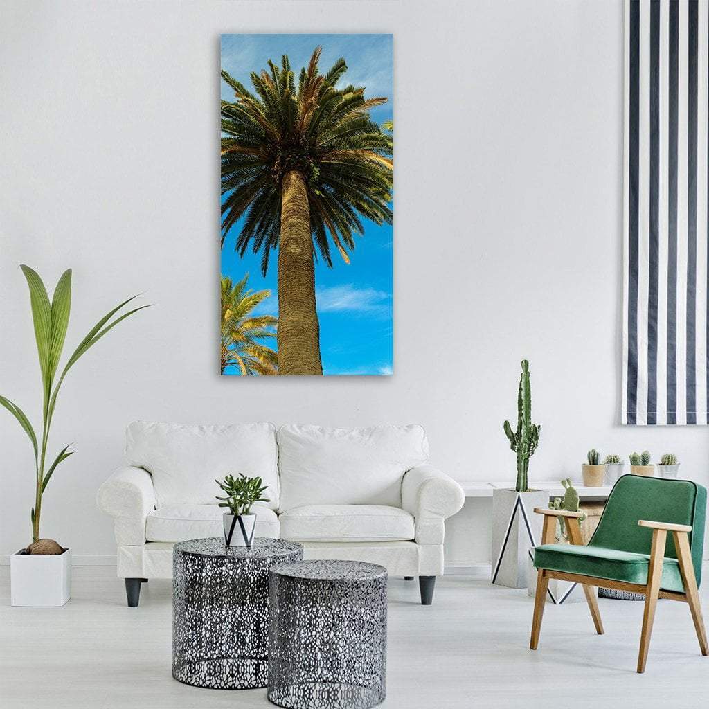 Tropical Palm Tree in Summer Vertical Canvas Wall Art in brown, green and blue, single vertical panel hung on a wall
