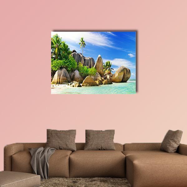 Tropical Island Beach with Granite Boulders Canvas Wall Art in beige, green and blue, single panel hung on a wall