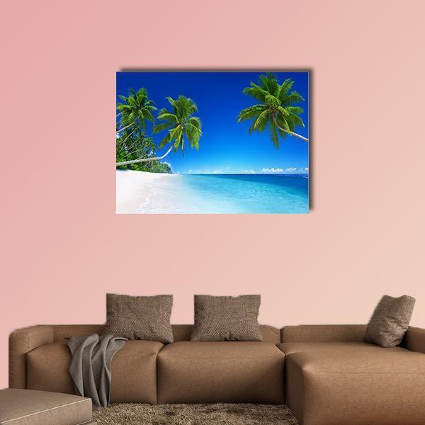 Tropical Beach Paradise Canvas Wall Art in white, green and blue, single panel hung on a wall