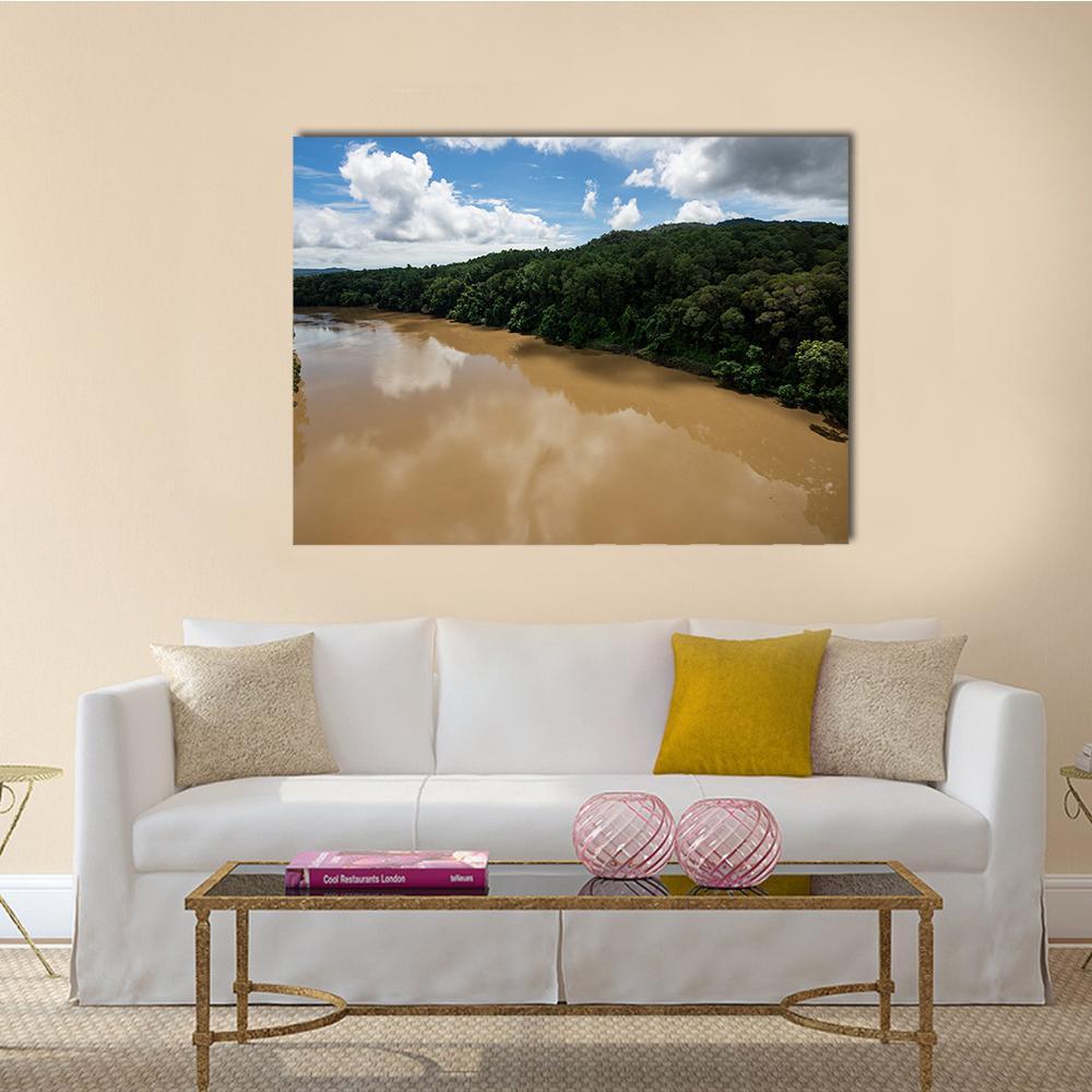 Kuranda Tropical Rainforest River View Canvas Wall Art in brown, green and blue, single panel hung on a wall