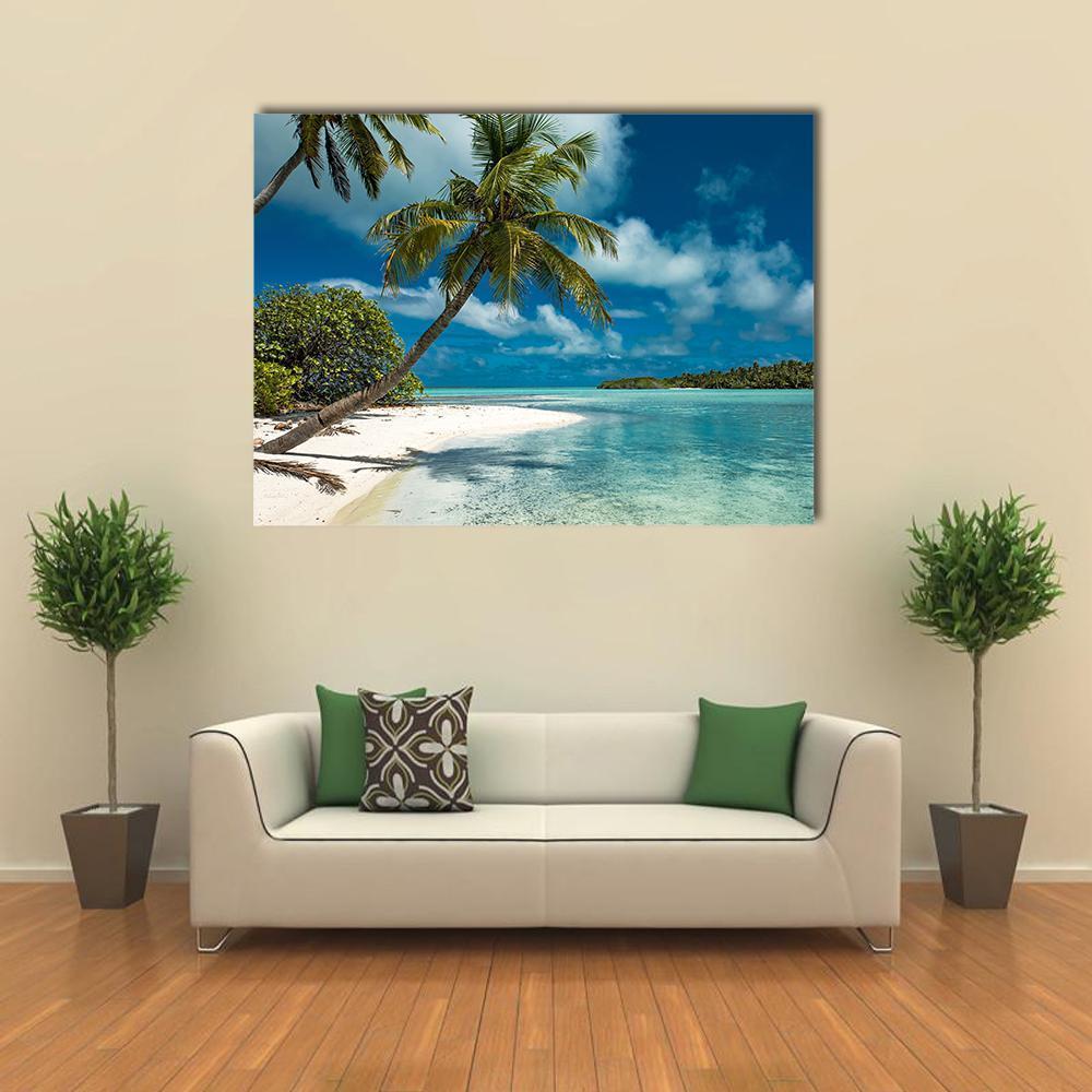 Tropical Sandy Beach with Palm Trees Canvas Wall Art in white, green and blue, single panel hung on a wall