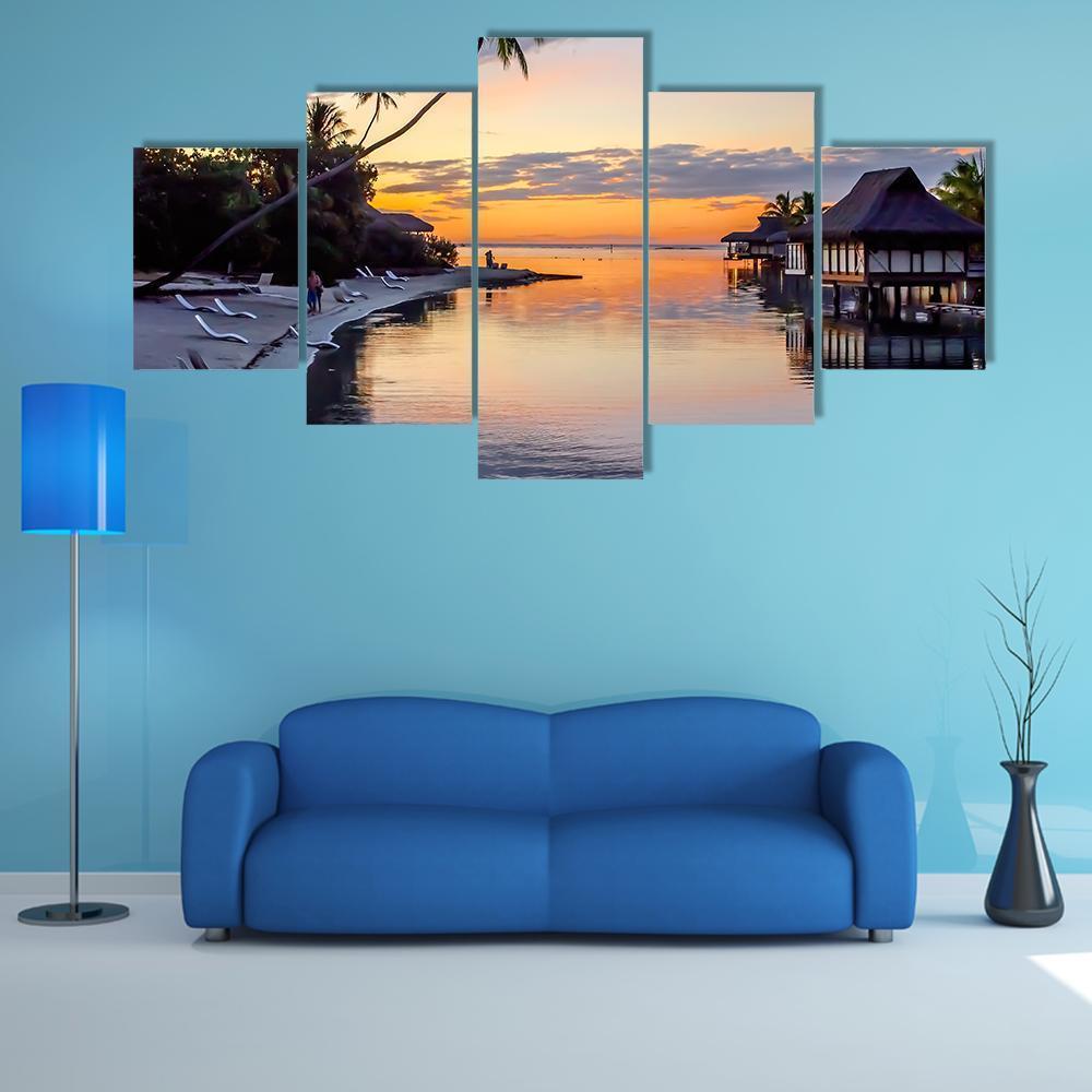 Tropical Sunset at Moorea Canvas Wall Art in gray, orange and blue, 5 panel Star layout hung on a wall