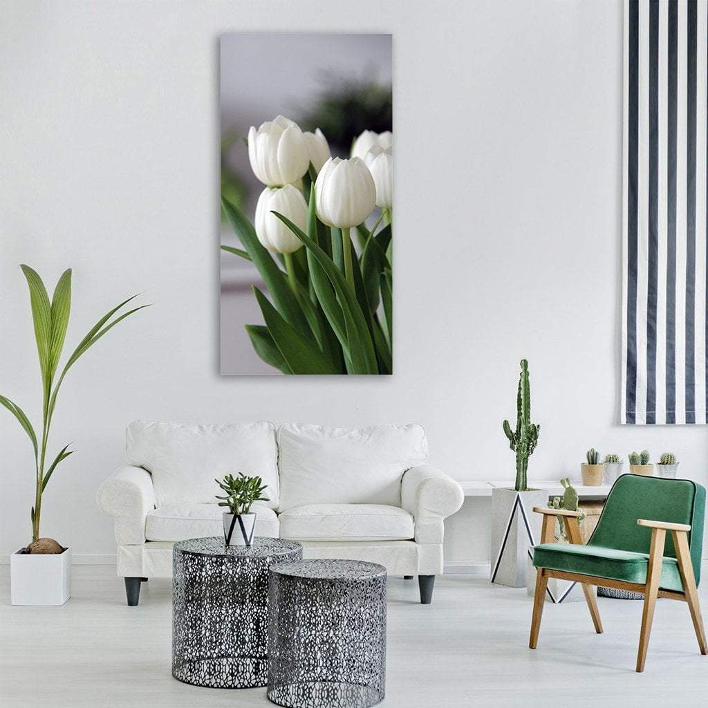 White Tulip Bouquet Close-up Vertical Canvas Wall Art in white, gray and green, hung on a wall