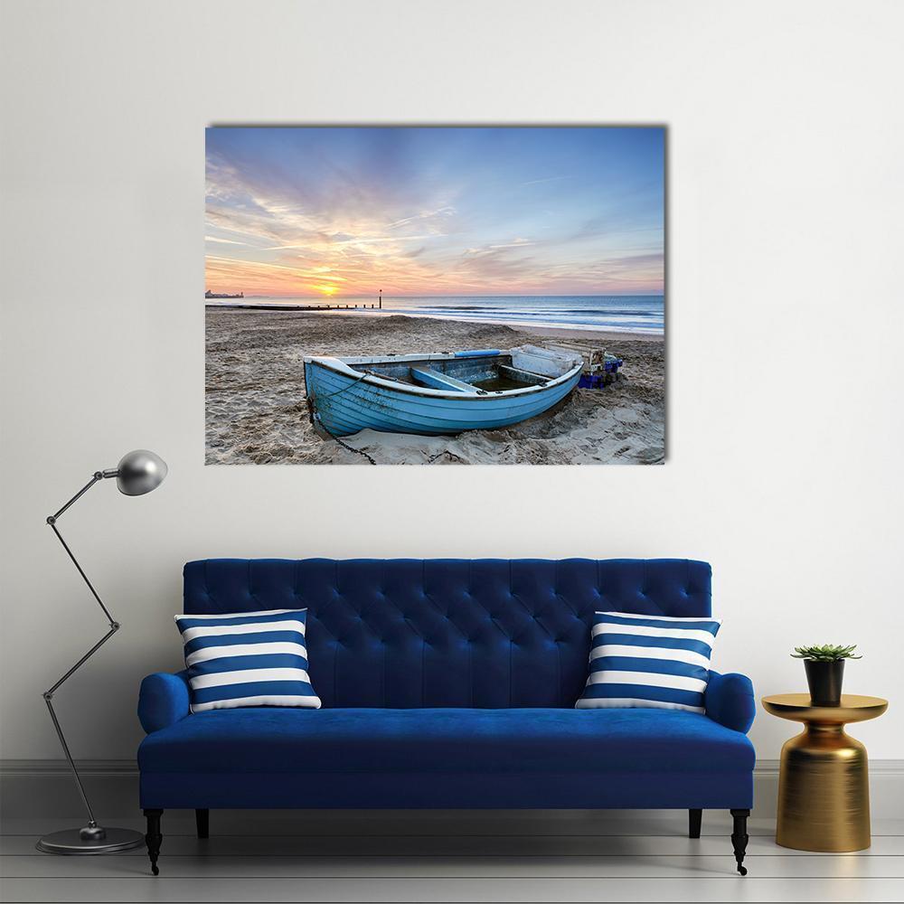 Turquoise Blue Fishing Boat at Sunrise Canvas Wall Art in beige, orange and blue, single panel hung on a wall