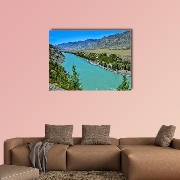 Turquoise River Through Mountain Valley Canvas Wall Art in gray, green and blue, single panel hung on a wall