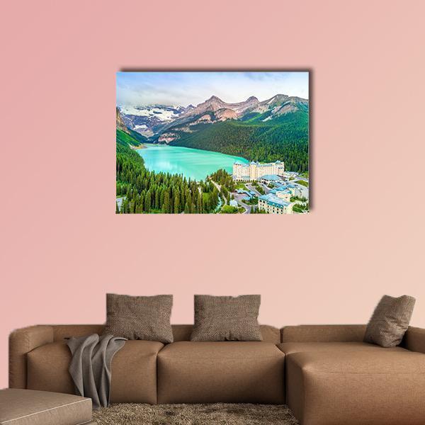 Turquoise Louise Lake with Hotel and Mountains Canvas Wall Art in white, green and blue, single panel hung on a wall