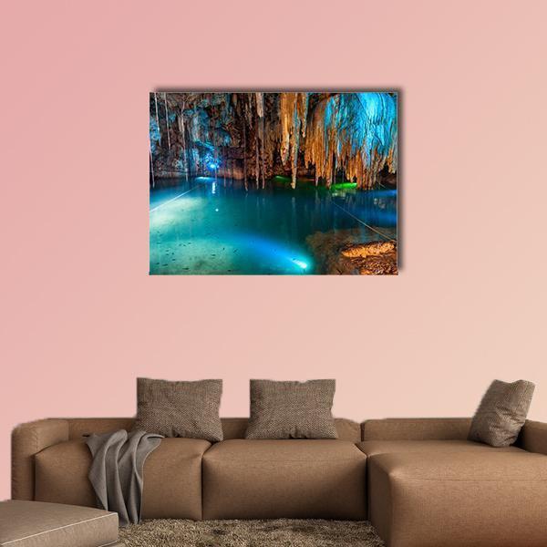 Turquoise Underground Lake with Stalactites Canvas Wall Art in brown, green and blue, single panel hung on a wall
