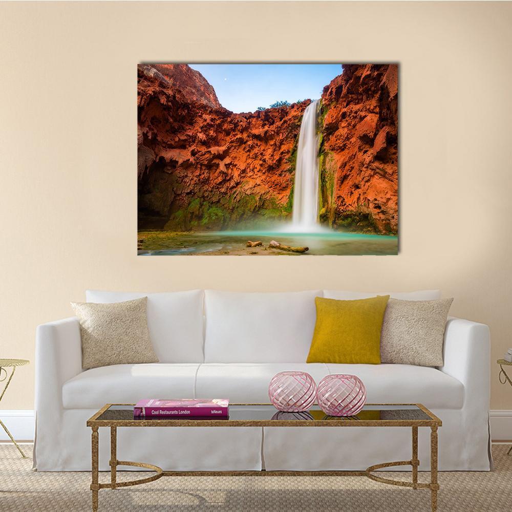 Turquoise Waters of Mooney Falls Canvas Wall Art in brown, orange and blue, single panel hung on a wall
