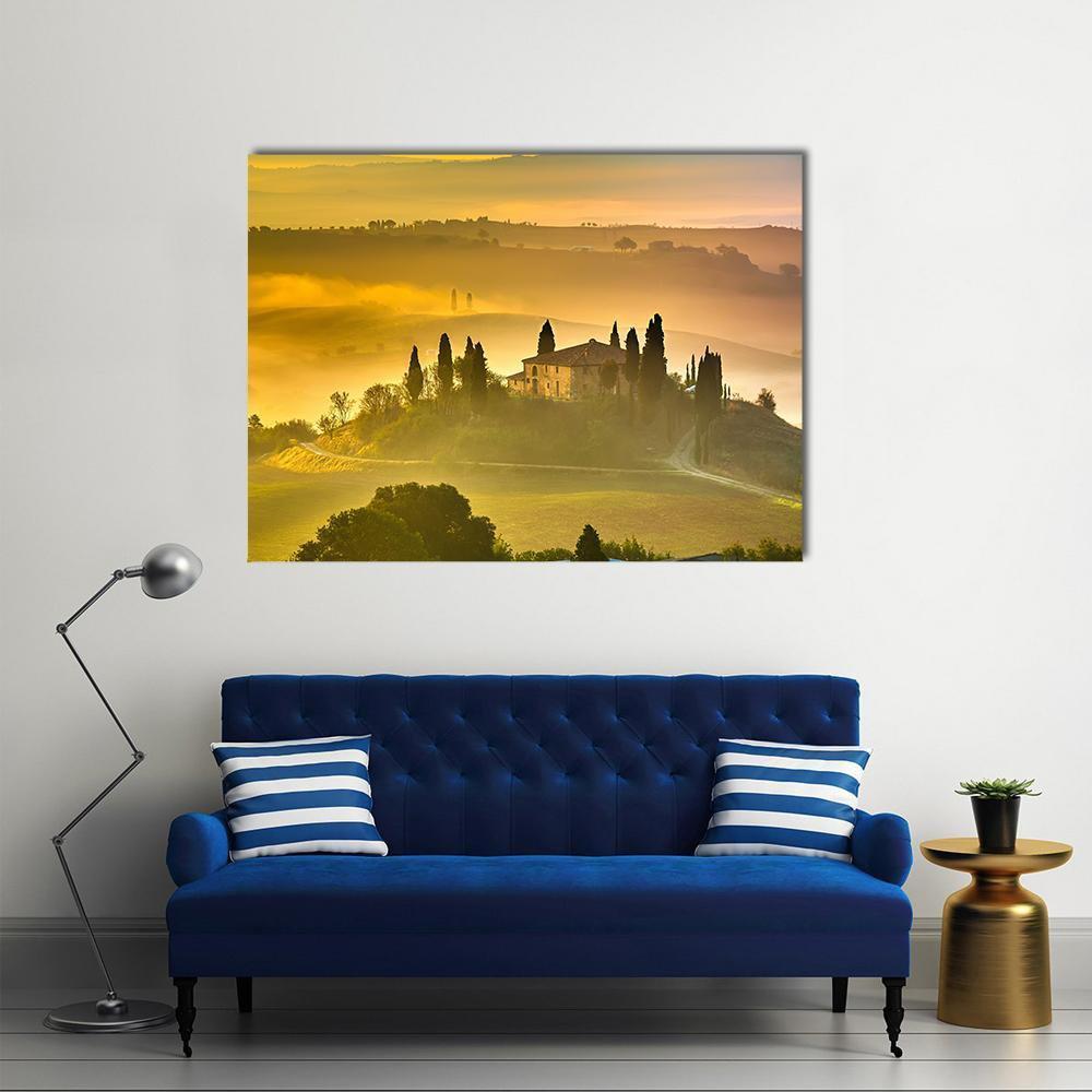 Tuscan Morning Villa Canvas Wall Art in orange, yellow and green, single panel hung on a wall