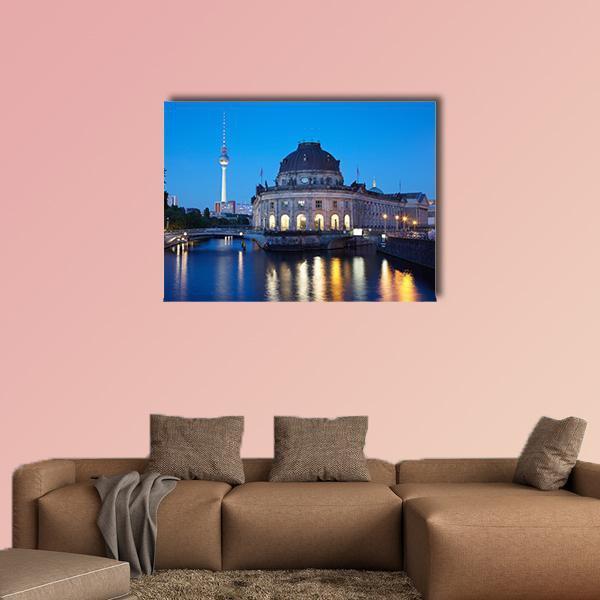 Berlin Tv Tower at Dusk Canvas Wall Art in yellow and blue, single panel hung on a wall