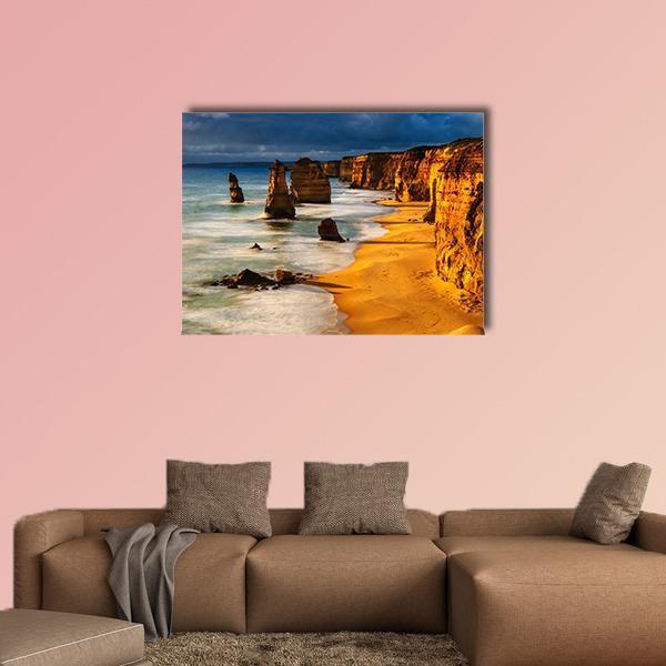 Twelve Apostles at Sunset Canvas Wall Art in brown, gold and blue, single panel hung on a wall