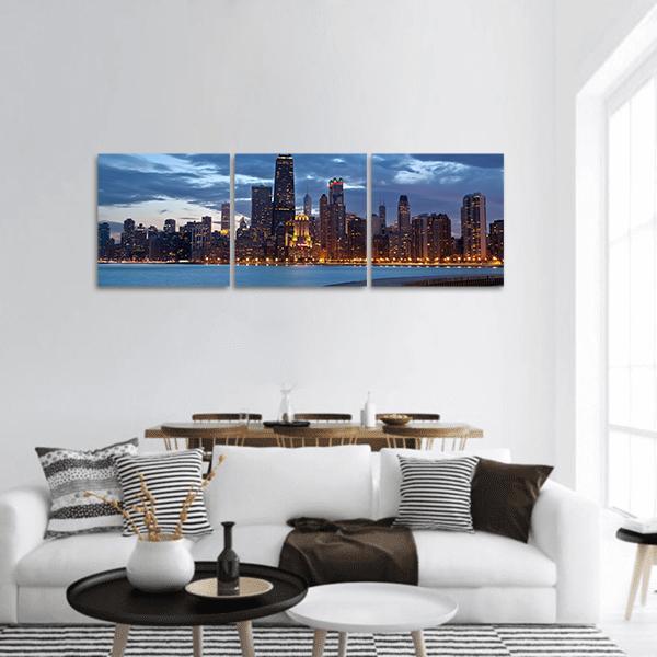 Chicago Twilight Blue Hour Skyline Panoramic Canvas Wall Art in black and blue, hung on a wall