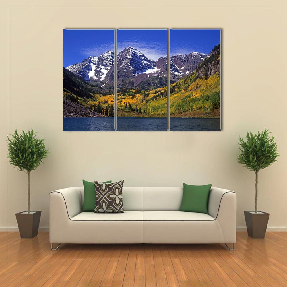 Maroon Bells in Fall Colors Canvas Wall Art in yellow, green and blue, 3 panel horizontal set hung on a wall