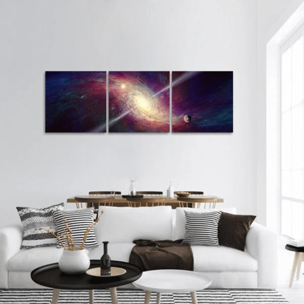 Twisted Spiral Galaxy with Diagonal Light Beams Panoramic Canvas Wall Art in yellow, blue and purple, hung on a wall