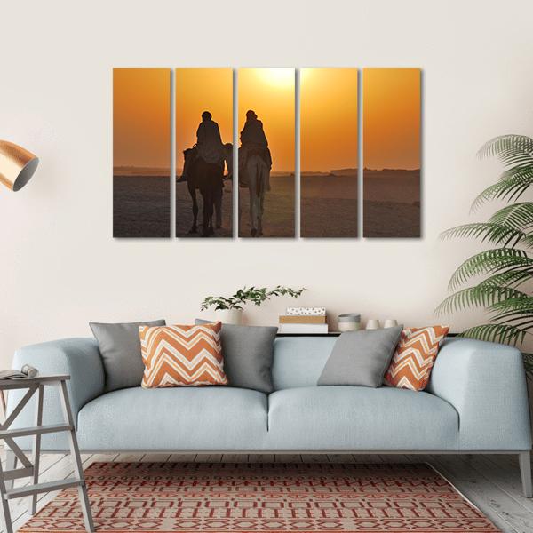 Two Camels Riding Towards Sun In Desert Canvas Wall Art-5 Horizontal-Gallery Wrap-22" x 12"-Tiaracle