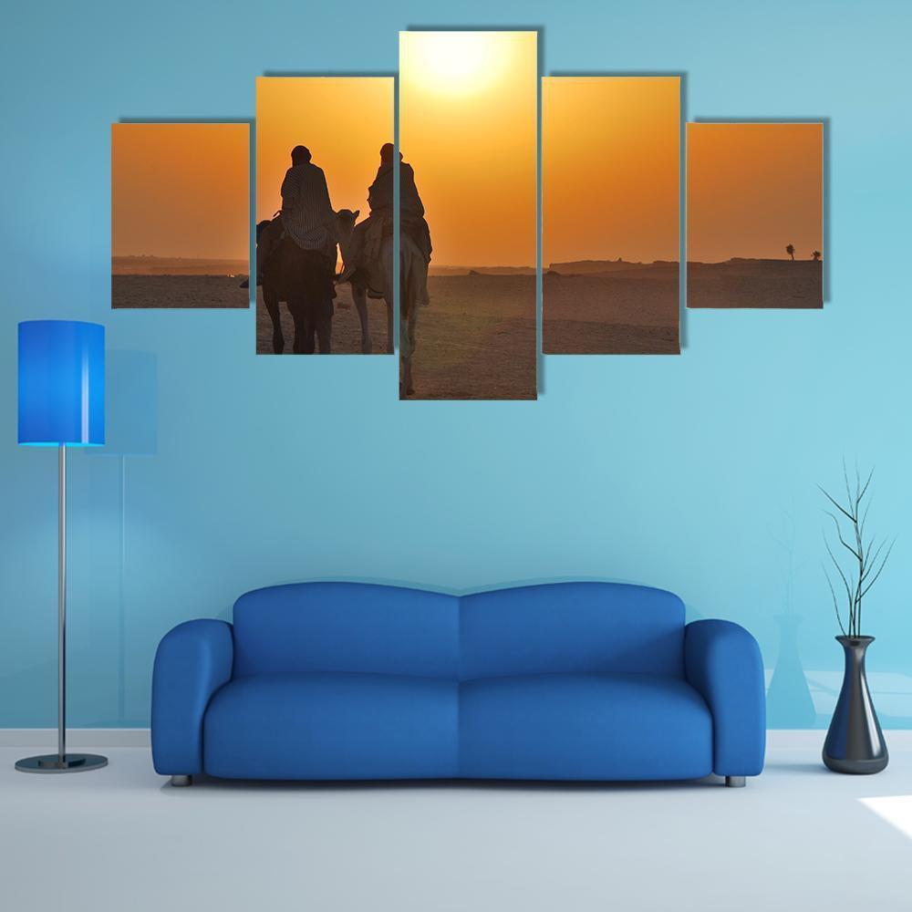 Two Camels Riding Towards Sun In Desert Canvas Wall Art-1 Piece-Gallery Wrap-48" x 32"-Tiaracle