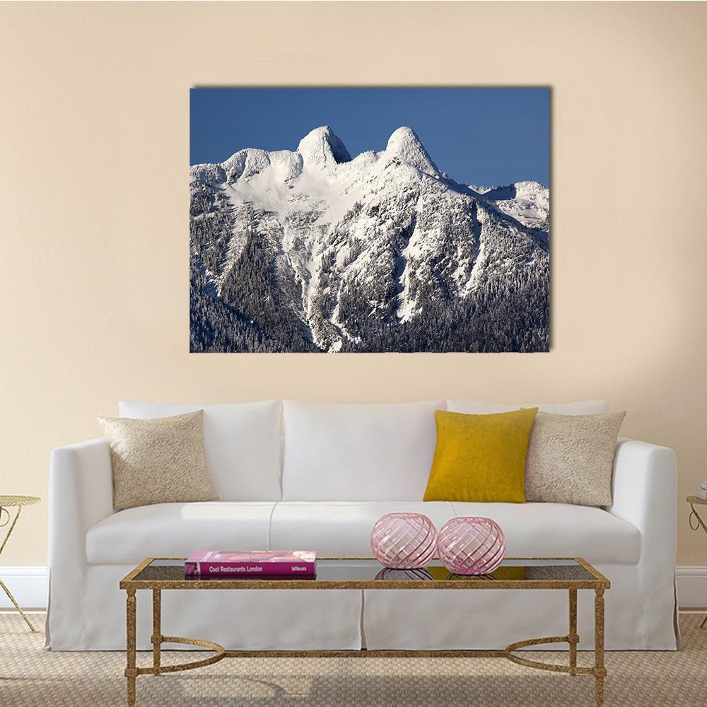 Snowy Mountain Landscape with Two Peaks Canvas Wall Art in white, gray and blue, single panel hung on a wall