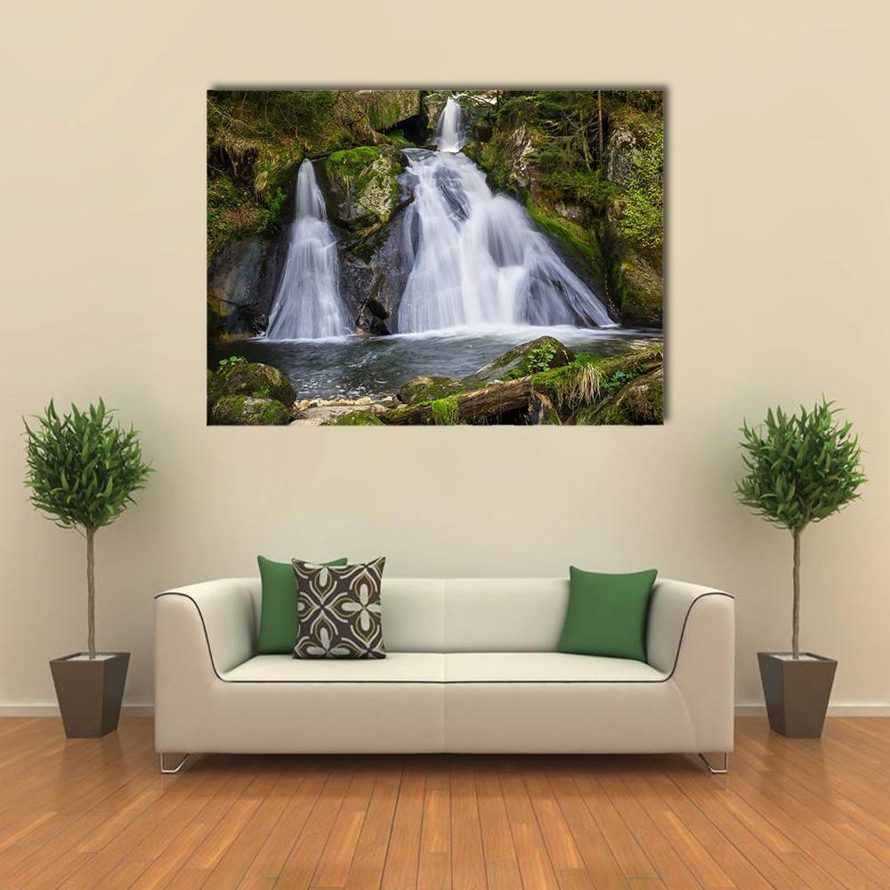 Two Terraced Waterfalls in Forest Canvas Wall Art in white, gray and green, single panel hung on a wall