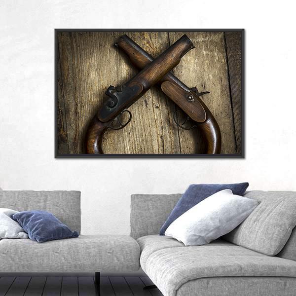 Vintage Pistols on Wooden Table Canvas Wall Art in black, brown and gold, framed canvas, product view on a white background
