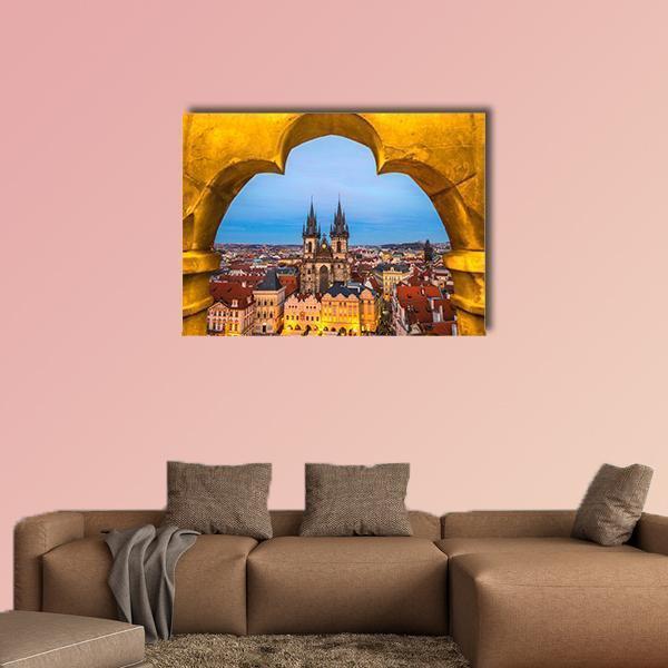 Tyn Church and Old Town Square, Prague Canvas Wall Art in orange, yellow and blue, single panel hung on a wall