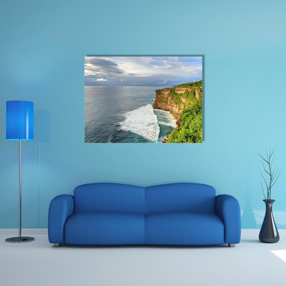 Uluwatu Temple Cliffside Ocean View Canvas Wall Art in gray, green and blue, single panel hung on a wall