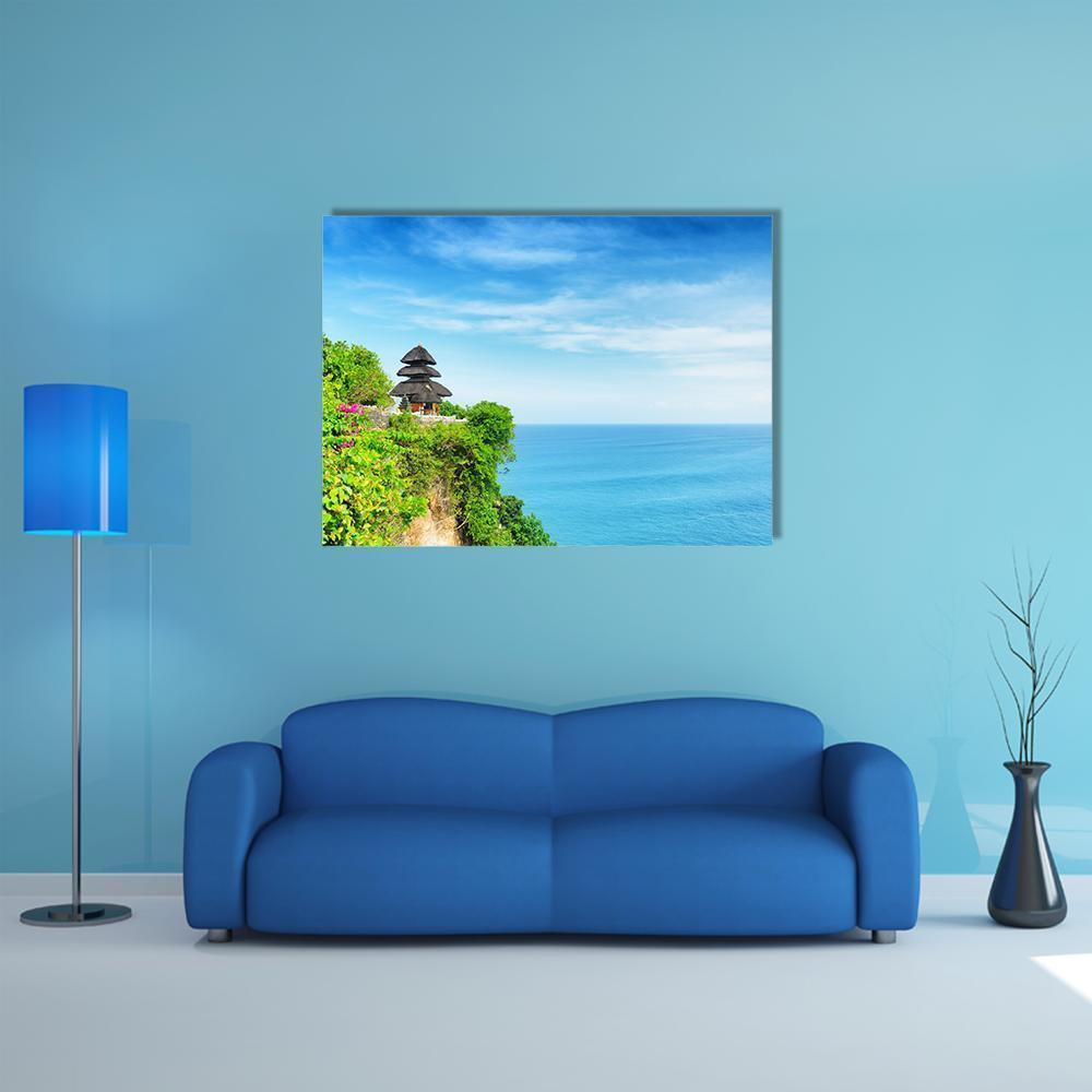 Uluwatu Cliffside Temple Canvas Wall Art in green and blue, single panel hung on a wall