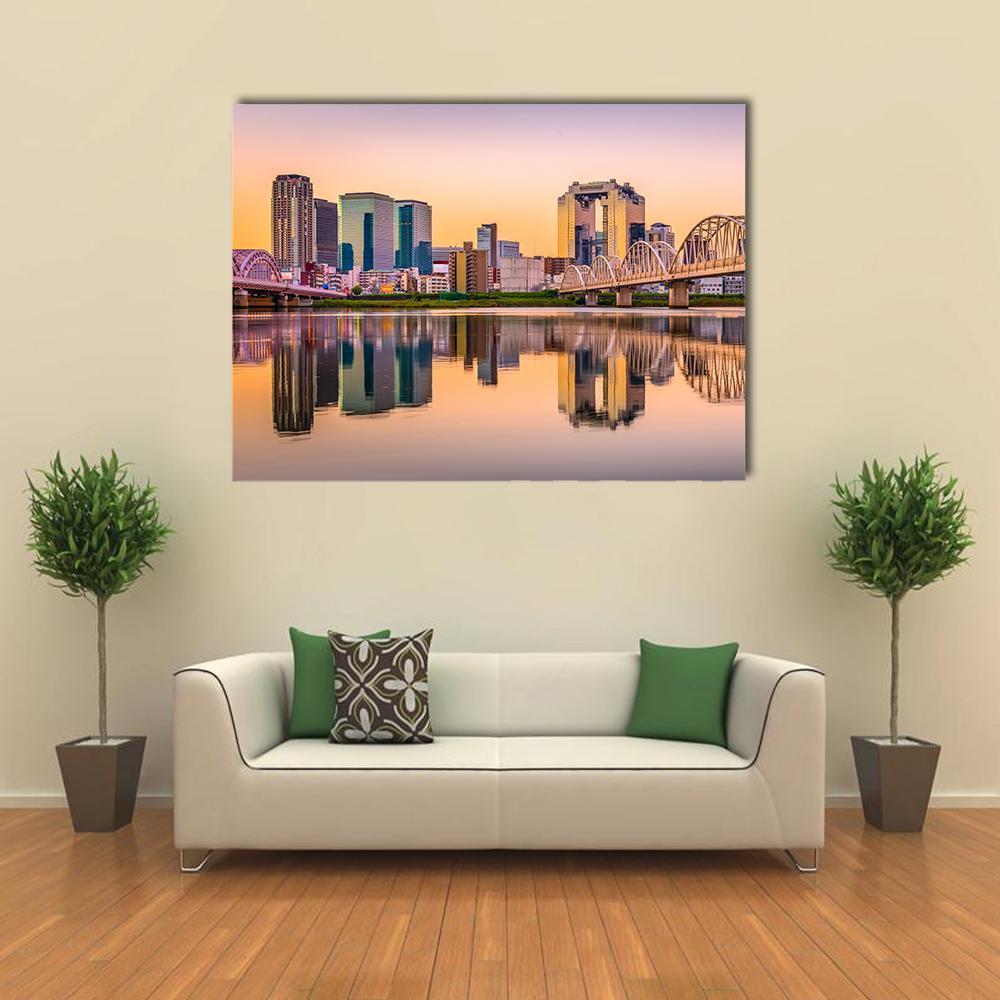 Umeda Skyline Over Yodogawa River Canvas Wall Art in orange, blue and purple, single panel hung on a wall